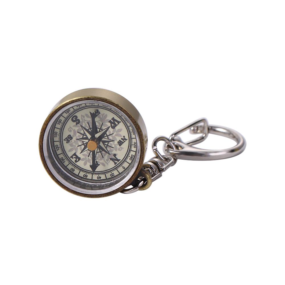 ゴールドカラーのナビゲーションツールポータブル亜鉛合金ペンダ - Compass Keychain Mini のレビューと価格